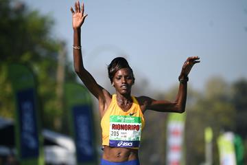 Purity Rionoripo en route to a course record at the Paris Marathon (AFP)